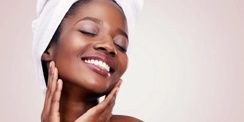 Woman with glowing skin after a plasma facial at The Smile Bar