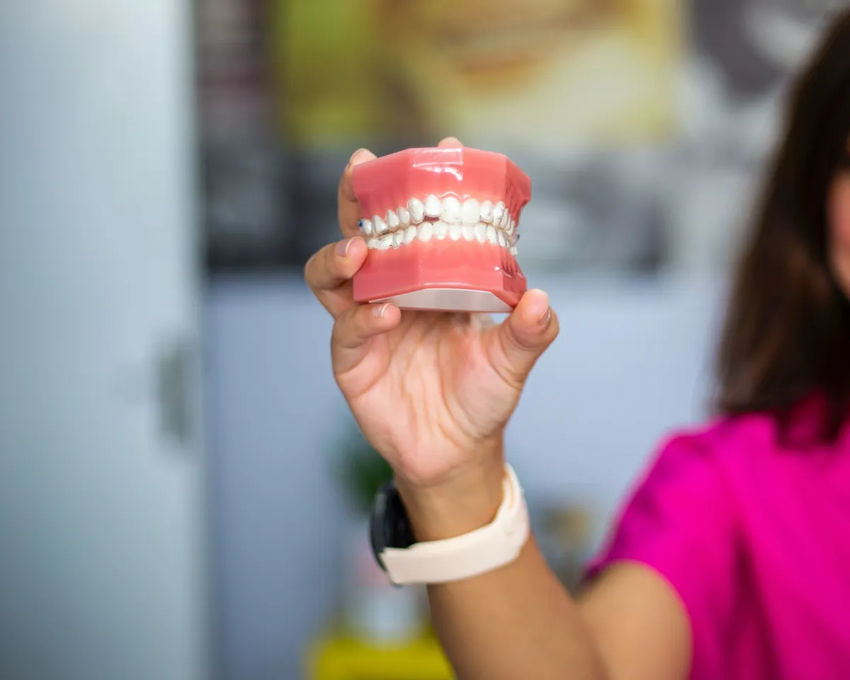 Traditional removable denture held in hand