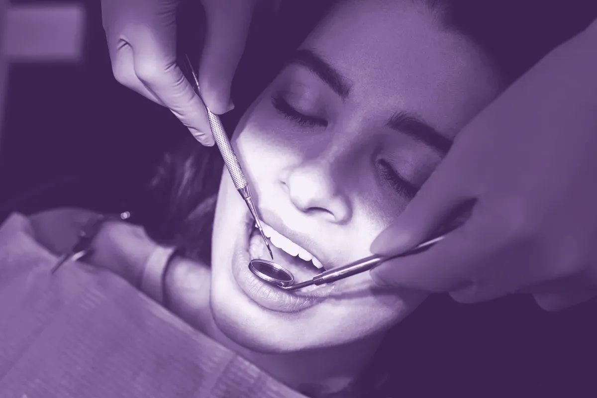Dentist performing a careful periodontal examination