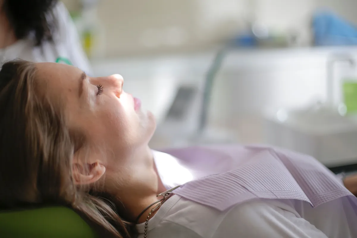 Patient resting calmly in the dental chair during a comfortable sedation visit