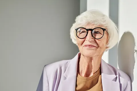 Woman smiling confidently with her implant-supported smile